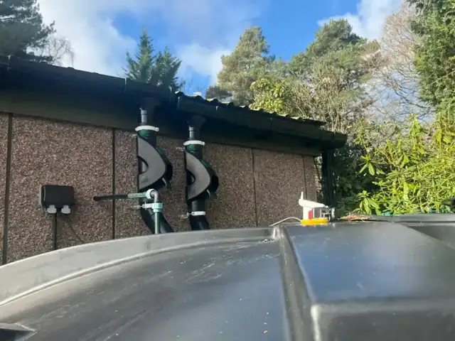 Engineer servicing a rainwater harvesting pump system