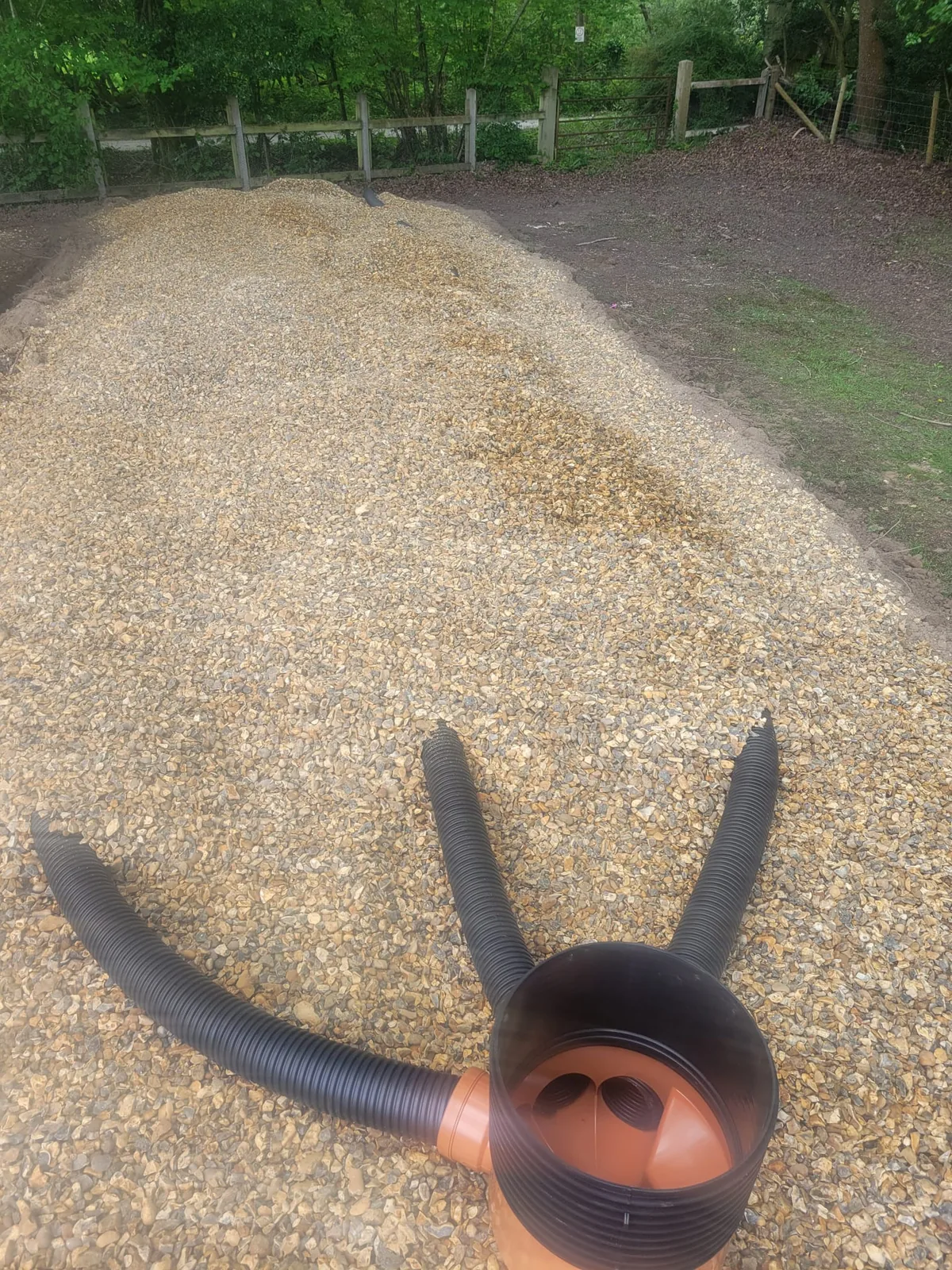 Washed drainage stone installed over mound drainage field
