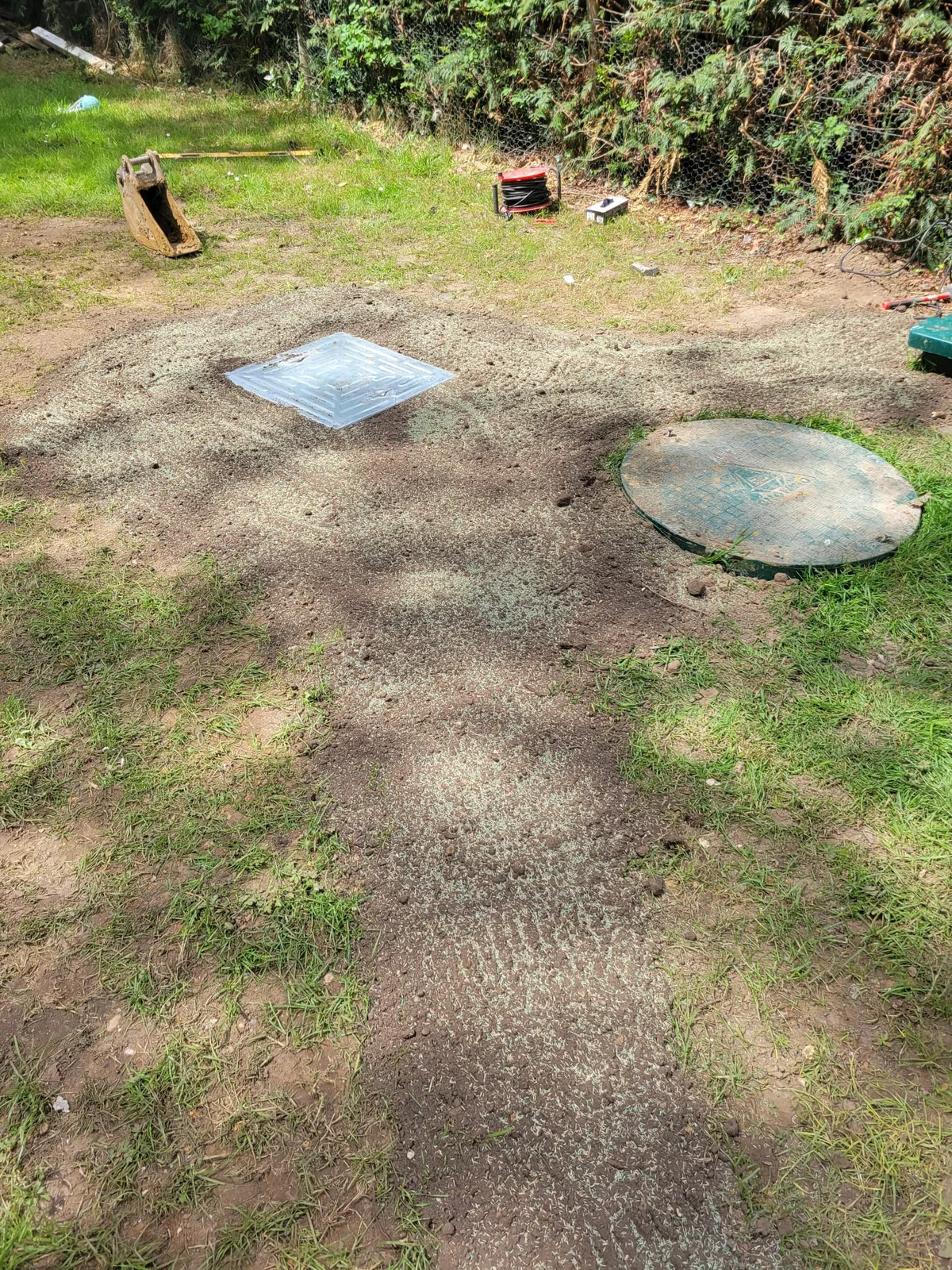 Topsoil reinstatement and seeding after mound drainage field installation