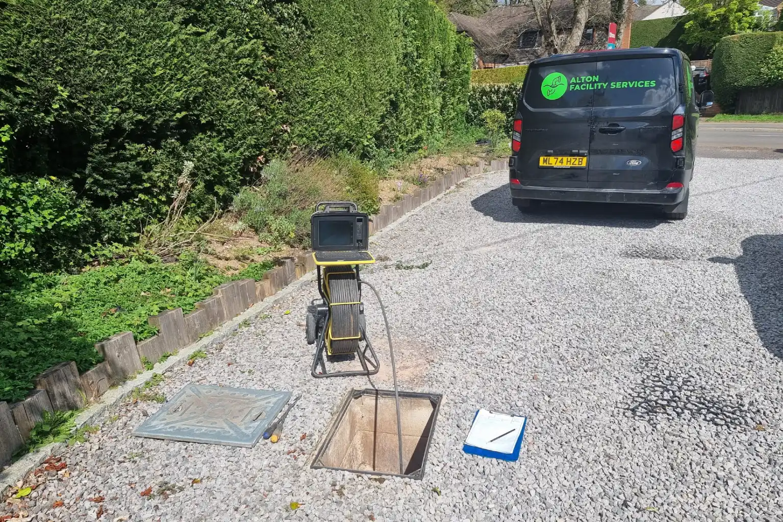 Commercial drainage engineers carrying out maintenance