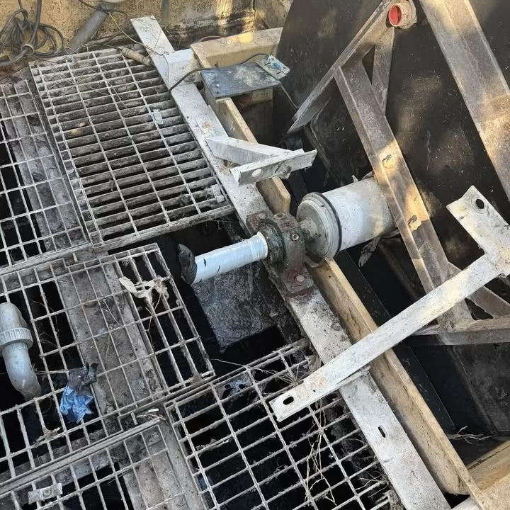 The empty tank showing the drive shaft and motor mounting points after desludging