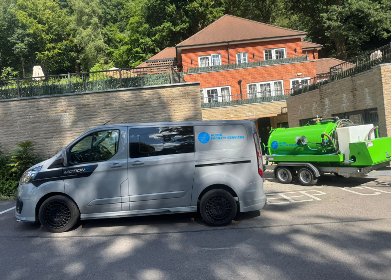 Pump station engineer inspecting pump system