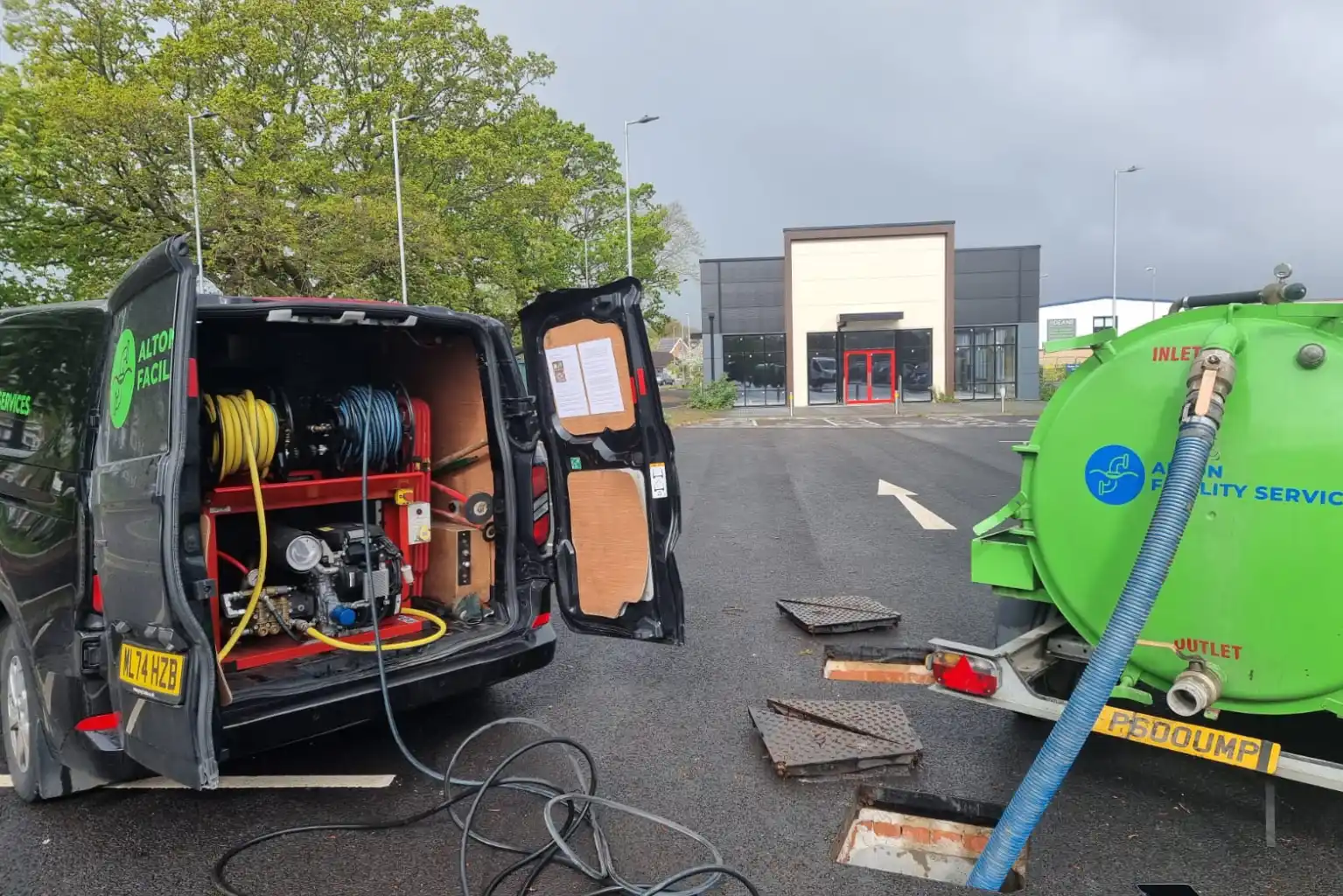 Sewage tanker carrying out emergency waste removal