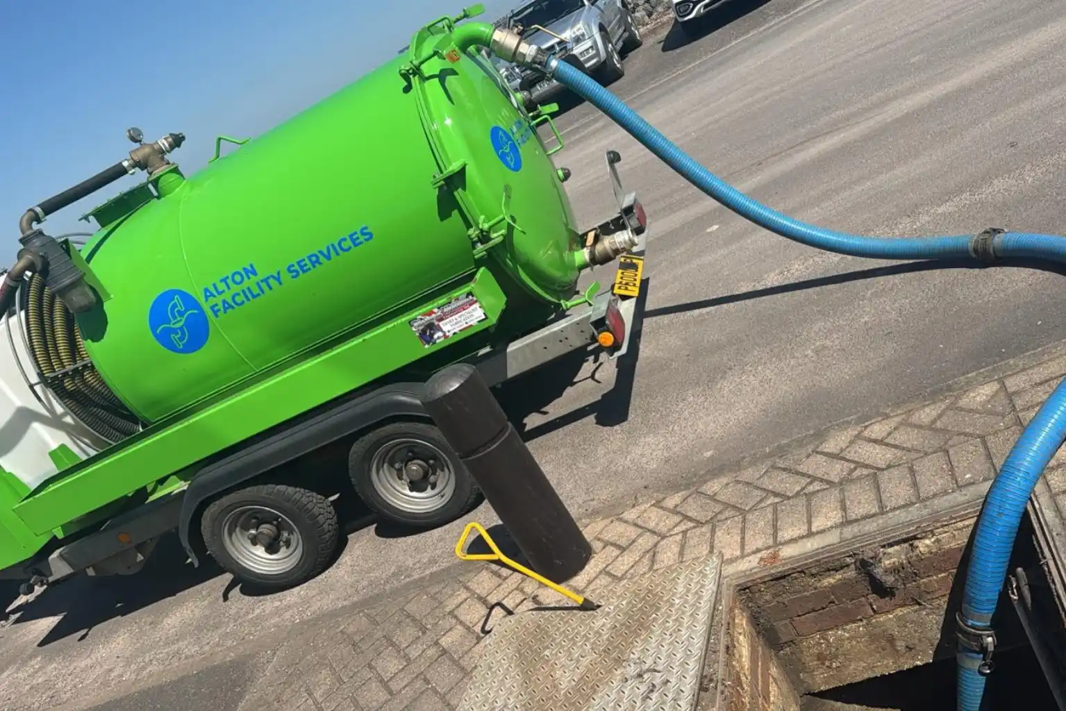 Vacuum tanker clearing flooded drainage system